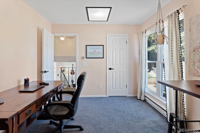 office featuring carpet, baseboards, and a textured ceiling