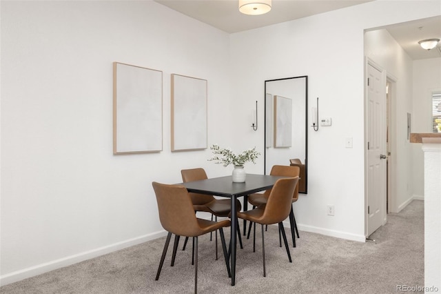 dining space with light carpet