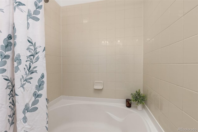 bathroom featuring shower / tub combo with curtain