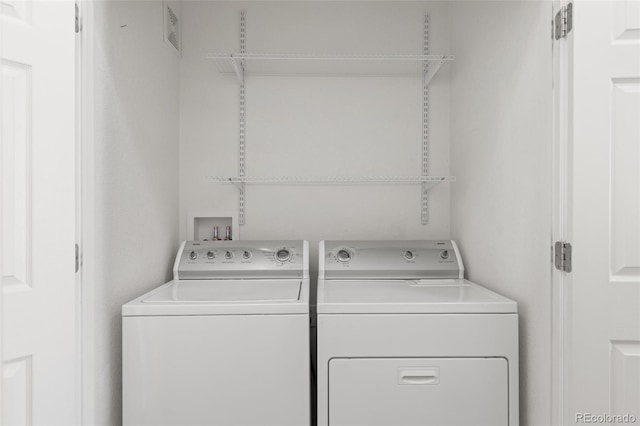 washroom with separate washer and dryer