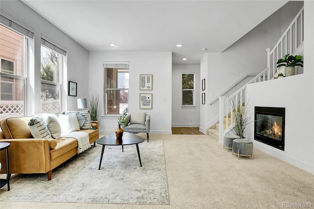 8458 Parkland St, Broomfield, CO 80021 - living area featuring stairway, healthy amount of natural light, recessed lighting, and carpet flooring