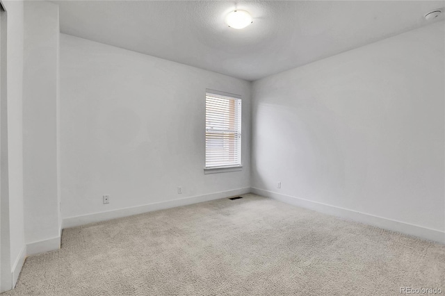 8458 Parkland St, Broomfield, CO 80021 - empty room with light colored carpet and a smoke detector