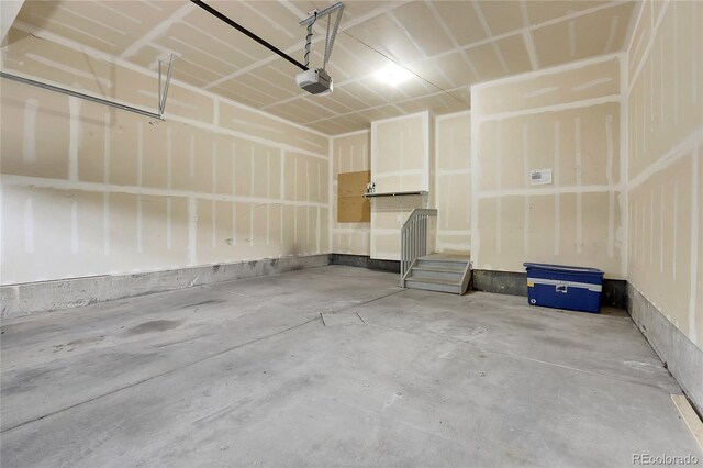 8458 Parkland St, Broomfield, CO 80021 - garage featuring a garage door opener