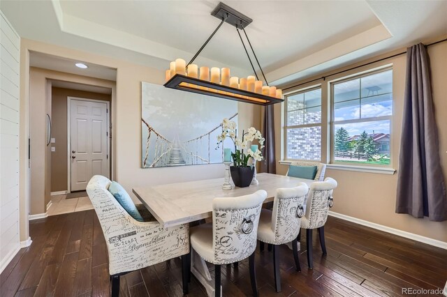 22197 E Stroll Ave, Parker, CO 80138 - dining space with a tray ceiling, baseboards, dark wood finished floors, a chandelier, and recessed lighting
