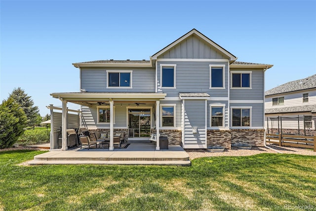 22197 E Stroll Ave, Parker, CO 80138 - rear view of house with a patio, outdoor lounge area, board and batten siding, and a ceiling fan