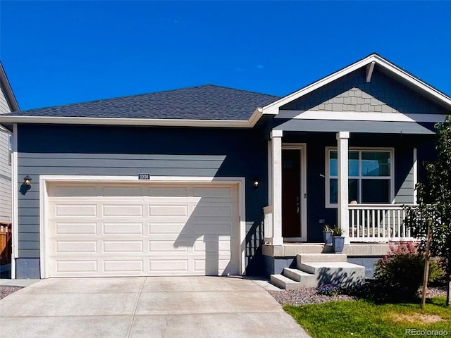 view of front of property featuring covered porch and a garage