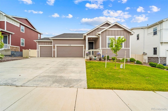 13138 Stoney Meadows Way, Peyton, CO 80831 - view of front of property with board and batten siding, a garage, and concrete driveway