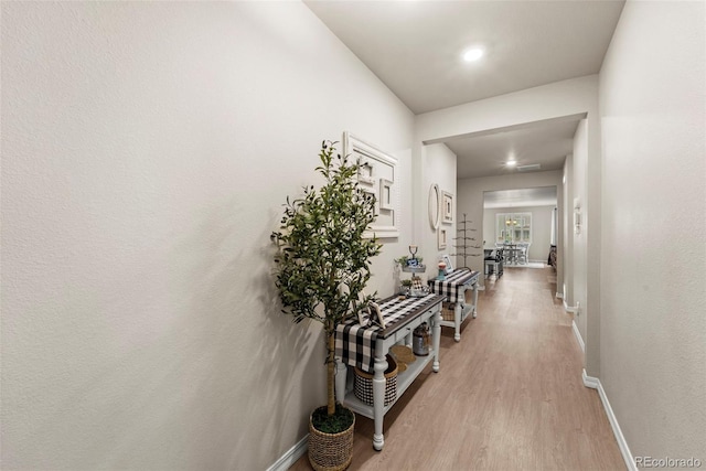 13138 Stoney Meadows Way, Peyton, CO 80831 - hallway featuring light wood-type flooring and baseboards
