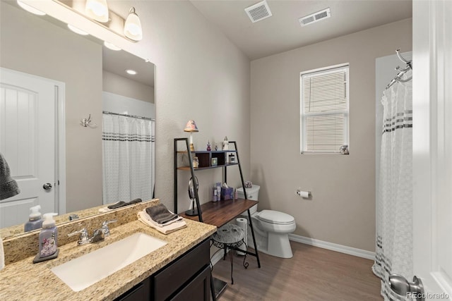 13138 Stoney Meadows Way, Peyton, CO 80831 - full bathroom with wood finished floors, vanity, and a shower with curtain
