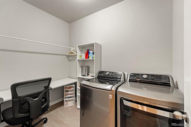 13138 Stoney Meadows Way, Peyton, CO 80831 - laundry area featuring separate washer and dryer and light wood-style floors
