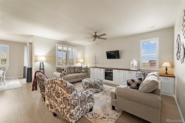 13138 Stoney Meadows Way, Peyton, CO 80831 - living room featuring light wood finished floors and ceiling fan