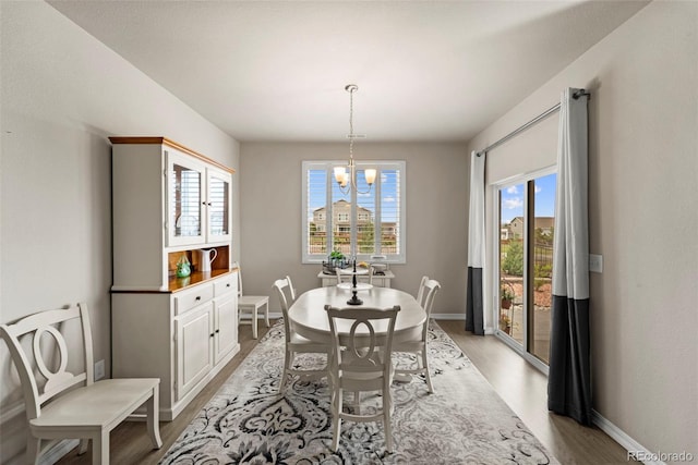 13138 Stoney Meadows Way, Peyton, CO 80831 - dining area featuring a chandelier, light wood-type flooring, and plenty of natural light