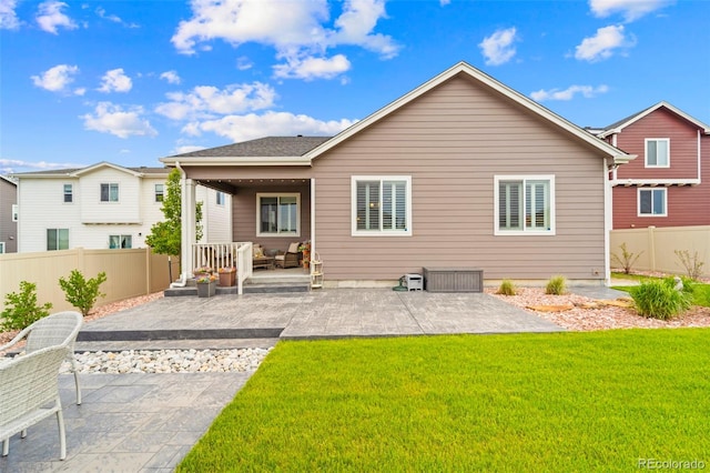 13138 Stoney Meadows Way, Peyton, CO 80831 - rear view of property featuring a patio area, outdoor lounge area, and a fenced backyard