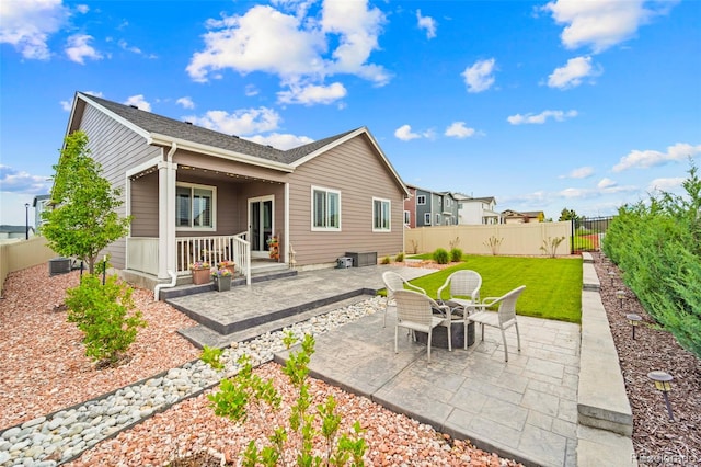 13138 Stoney Meadows Way, Peyton, CO 80831 - rear view of house featuring a patio area and a fenced backyard