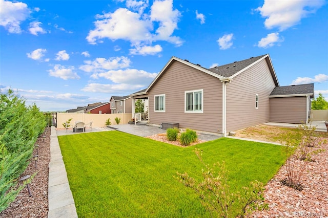 13138 Stoney Meadows Way, Peyton, CO 80831 - back of house with a patio area and roof with shingles