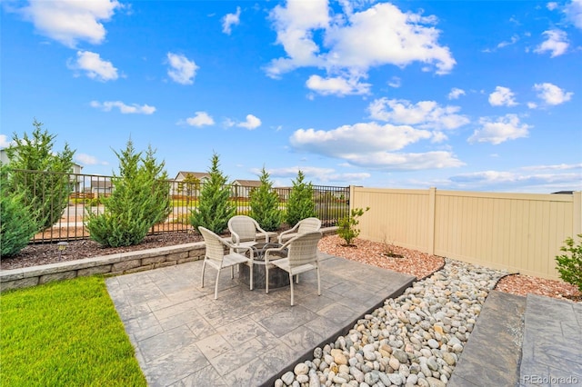13138 Stoney Meadows Way, Peyton, CO 80831 - fenced backyard featuring a patio and outdoor dining space