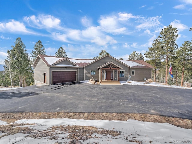 view of front of property featuring an attached garage and driveway