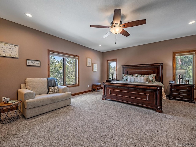 bedroom with recessed lighting, baseboards, multiple windows, and carpet