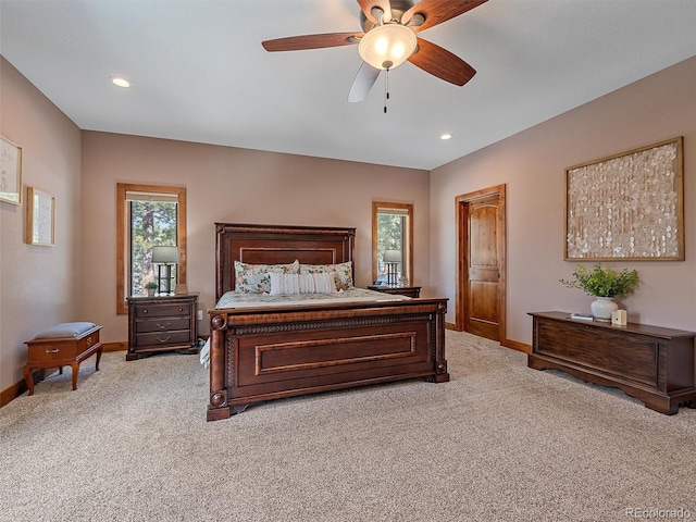 bedroom featuring recessed lighting, baseboards, and light colored carpet