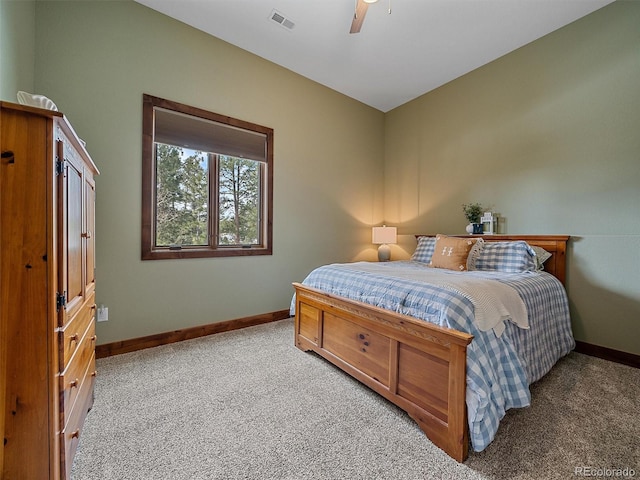 bedroom with ceiling fan, baseboards, visible vents, and light carpet