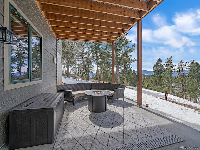 view of patio with a fire pit