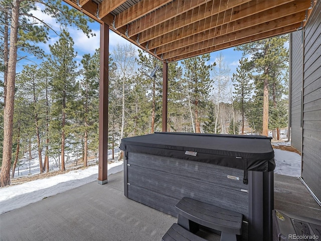 view of patio / terrace with a hot tub