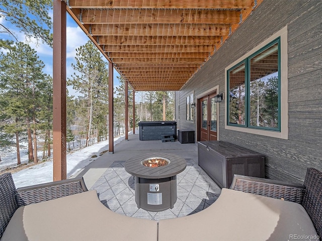 view of patio with french doors and a hot tub