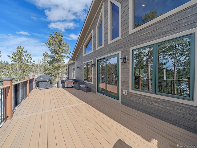 wooden terrace featuring area for grilling