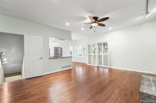 9365 Erminedale Dr, Lone Tree, CO 80124 - unfurnished living room featuring a ceiling fan, wood finished floors, and recessed lighting
