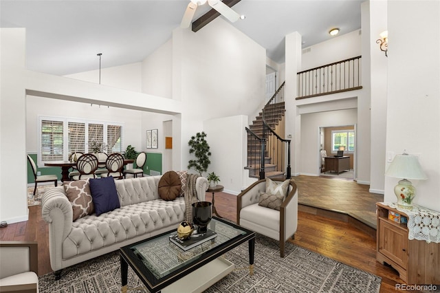 9365 Erminedale Dr, Lone Tree, CO 80124 - living room featuring stairs, wood finished floors, high vaulted ceiling, and ceiling fan