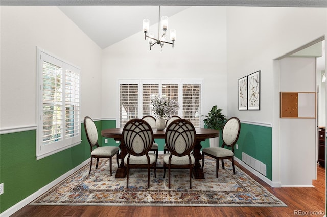 9365 Erminedale Dr, Lone Tree, CO 80124 - dining room with a chandelier, wood finished floors, and high vaulted ceiling