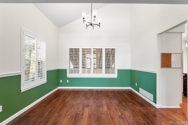 9365 Erminedale Dr, Lone Tree, CO 80124 - unfurnished dining area with a chandelier, lofted ceiling, and wood finished floors