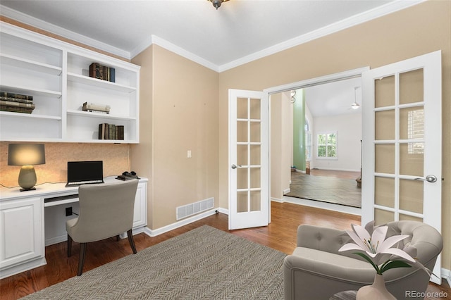 9365 Erminedale Dr, Lone Tree, CO 80124 - office featuring french doors, dark wood-style floors, ornamental molding, built in desk, and a ceiling fan