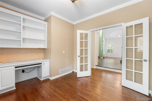 9365 Erminedale Dr, Lone Tree, CO 80124 - unfurnished office featuring french doors, crown molding, dark wood finished floors, built in desk, and ceiling fan