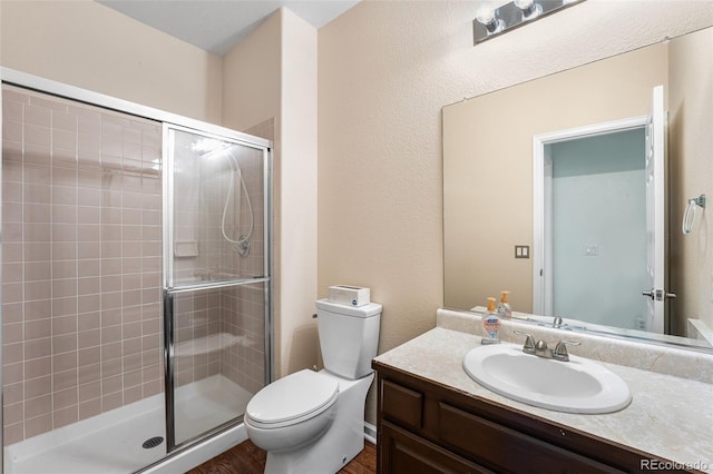 9365 Erminedale Dr, Lone Tree, CO 80124 - bathroom featuring a shower stall, vanity, and wood finished floors