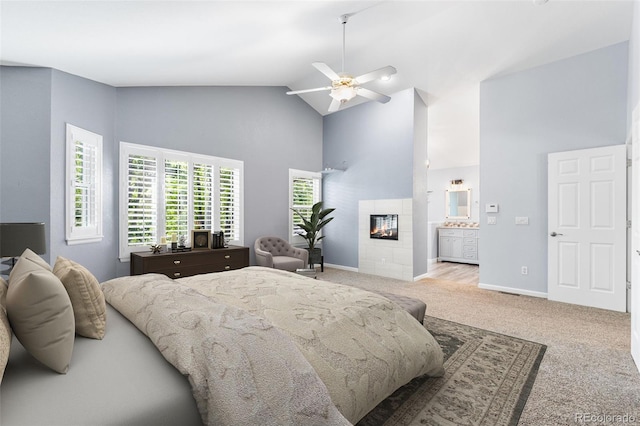 9365 Erminedale Dr, Lone Tree, CO 80124 - bedroom with high vaulted ceiling, carpet floors, a fireplace, ensuite bathroom, and ceiling fan