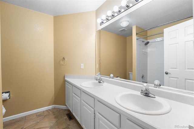 9365 Erminedale Dr, Lone Tree, CO 80124 - bathroom with double vanity and a shower