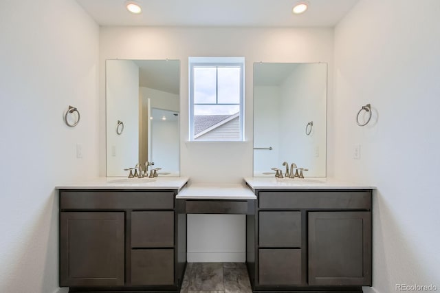 4588 Thistle Dr, Brighton, CO 80601 - full bathroom featuring two vanities