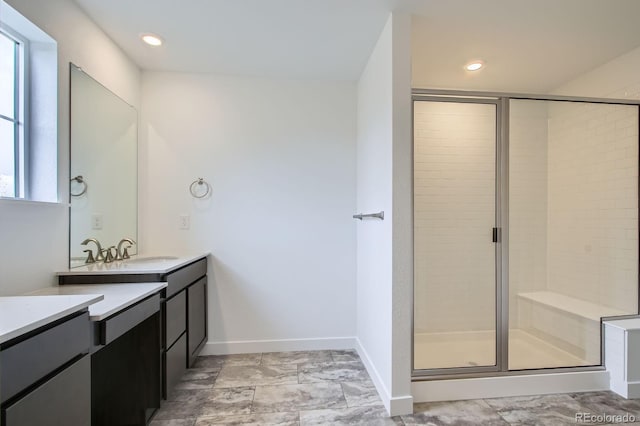 4588 Thistle Dr, Brighton, CO 80601 - bathroom with a stall shower, vanity, baseboards, and recessed lighting