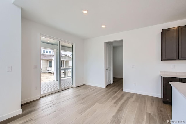 4588 Thistle Dr, Brighton, CO 80601 - unfurnished dining area with light wood-type flooring, baseboards, and recessed lighting