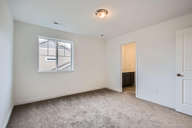 4588 Thistle Dr, Brighton, CO 80601 - unfurnished bedroom featuring carpet flooring, baseboards, and ensuite bathroom