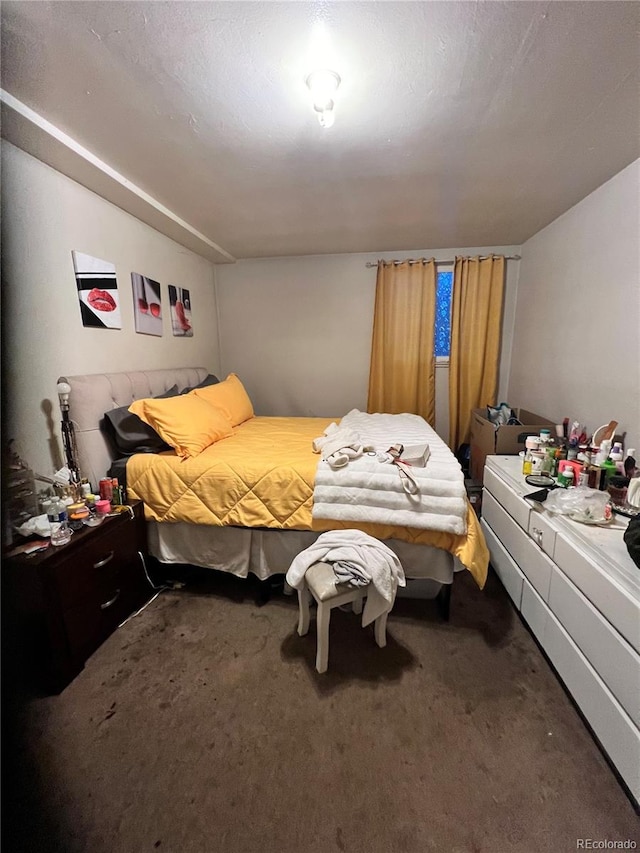 carpeted bedroom with a textured ceiling