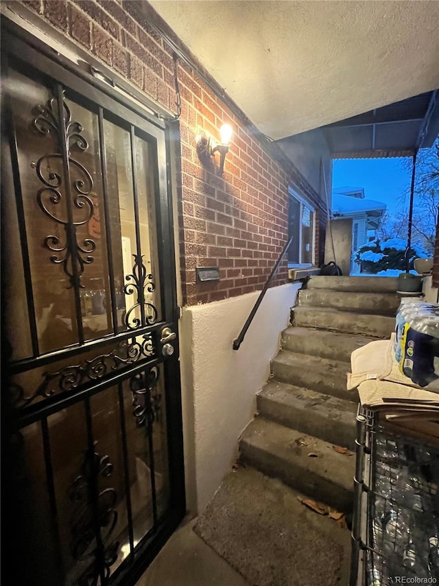 stairway with brick wall