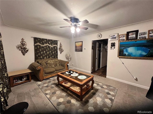 living room with dark colored carpet and ceiling fan