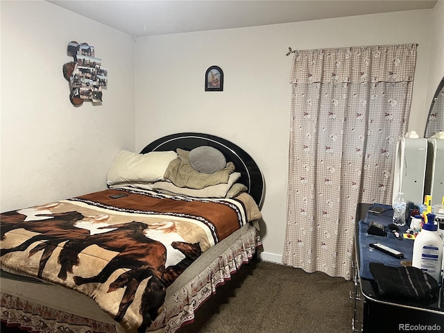 bedroom with dark carpet