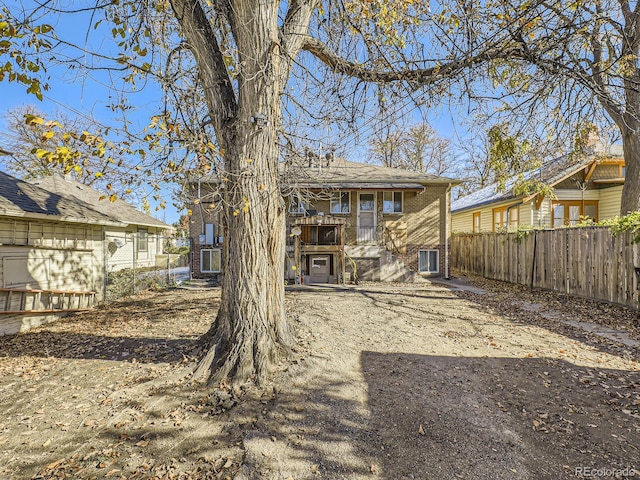 back of property featuring central AC unit