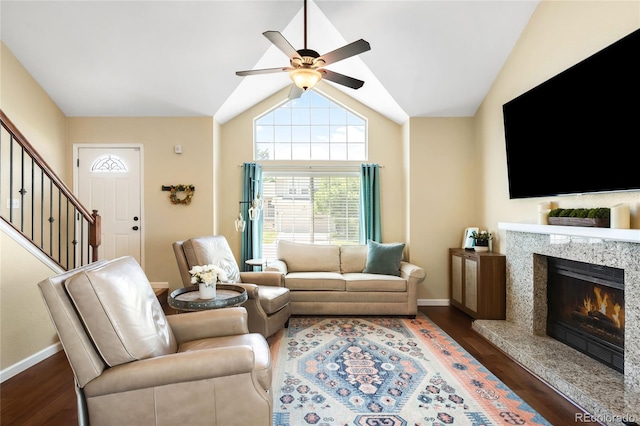 20389 E Powers Pl, Centennial, CO 80015 - living area featuring a ceiling fan, wood finished floors, stairs, a high end fireplace, and vaulted ceiling