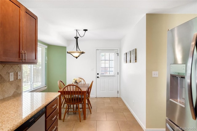 20389 E Powers Pl, Centennial, CO 80015 - dining space with light tile patterned floors and baseboards