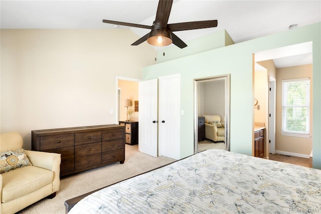 20389 E Powers Pl, Centennial, CO 80015 - bedroom with light carpet, ceiling fan, high vaulted ceiling, and ensuite bathroom
