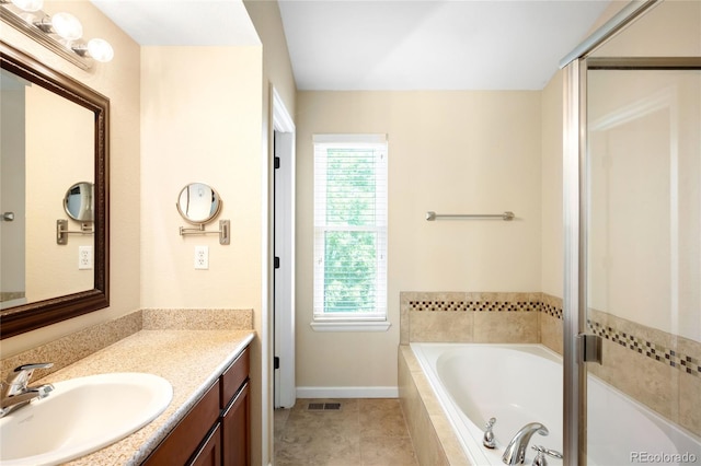 20389 E Powers Pl, Centennial, CO 80015 - bathroom featuring vanity, plenty of natural light, a garden tub, and a shower with door